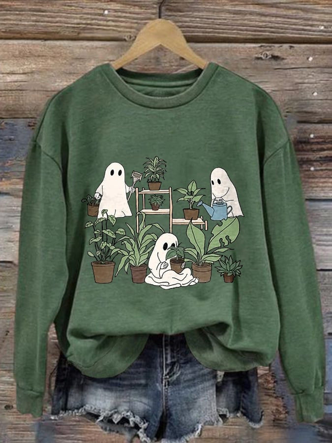 Sweatshirt with playful ghosts tending a potted garden