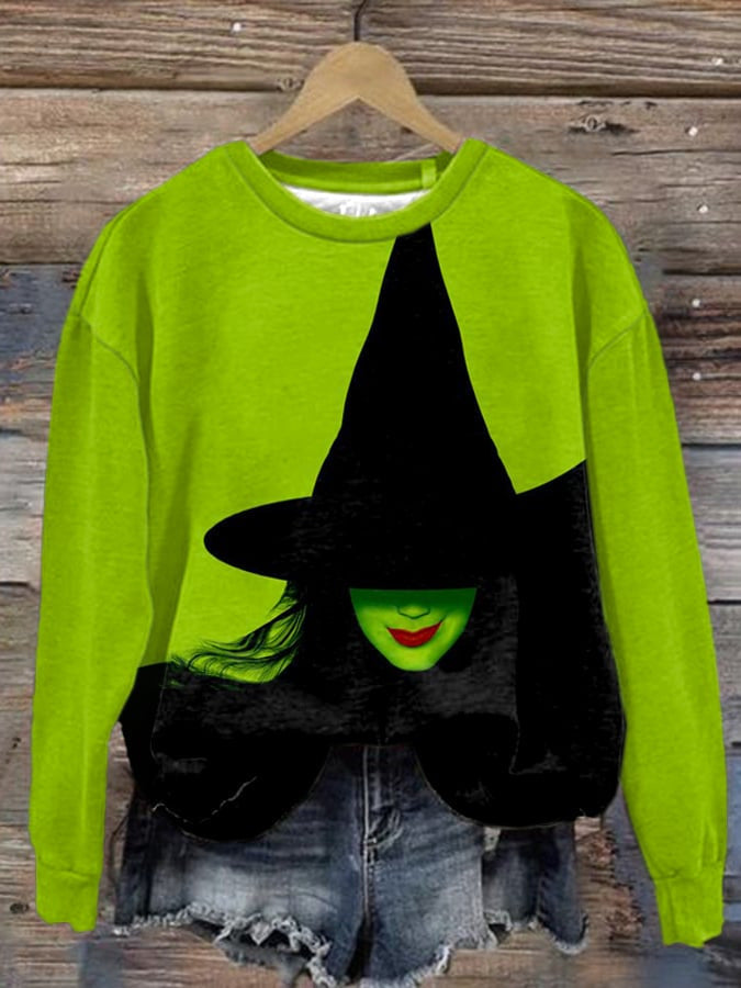 Electric green sweatshirt with black shadow witch graphic