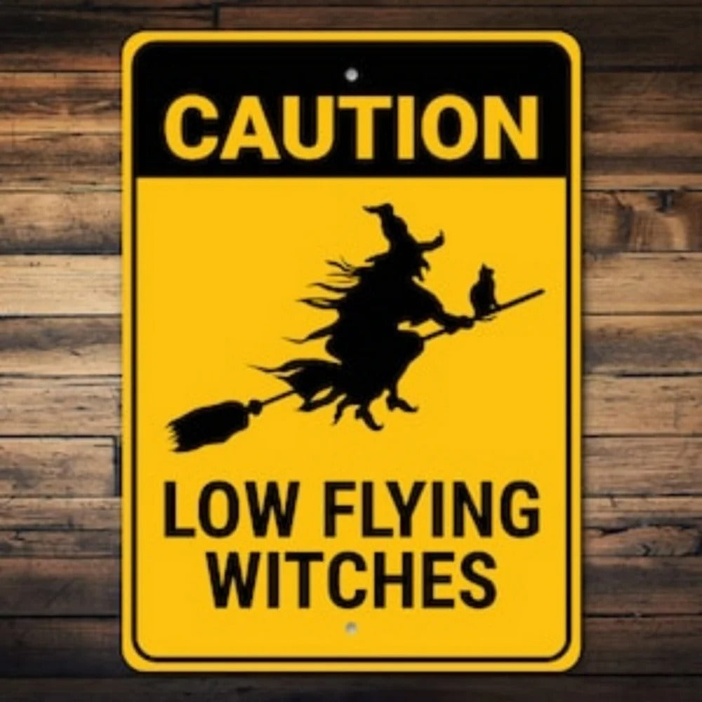 Caution: Low Flying Witches Sign