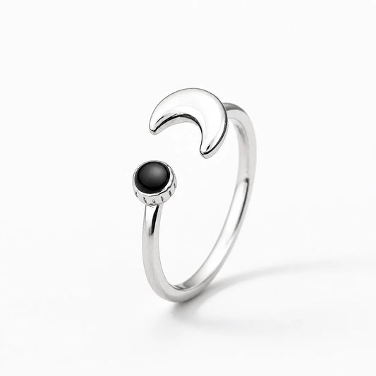 Midnight Crescent Charm Ring on a near-white studio background