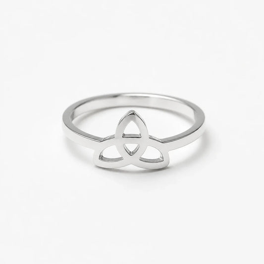 Polished silver Triquetra ring on a near-white studio background