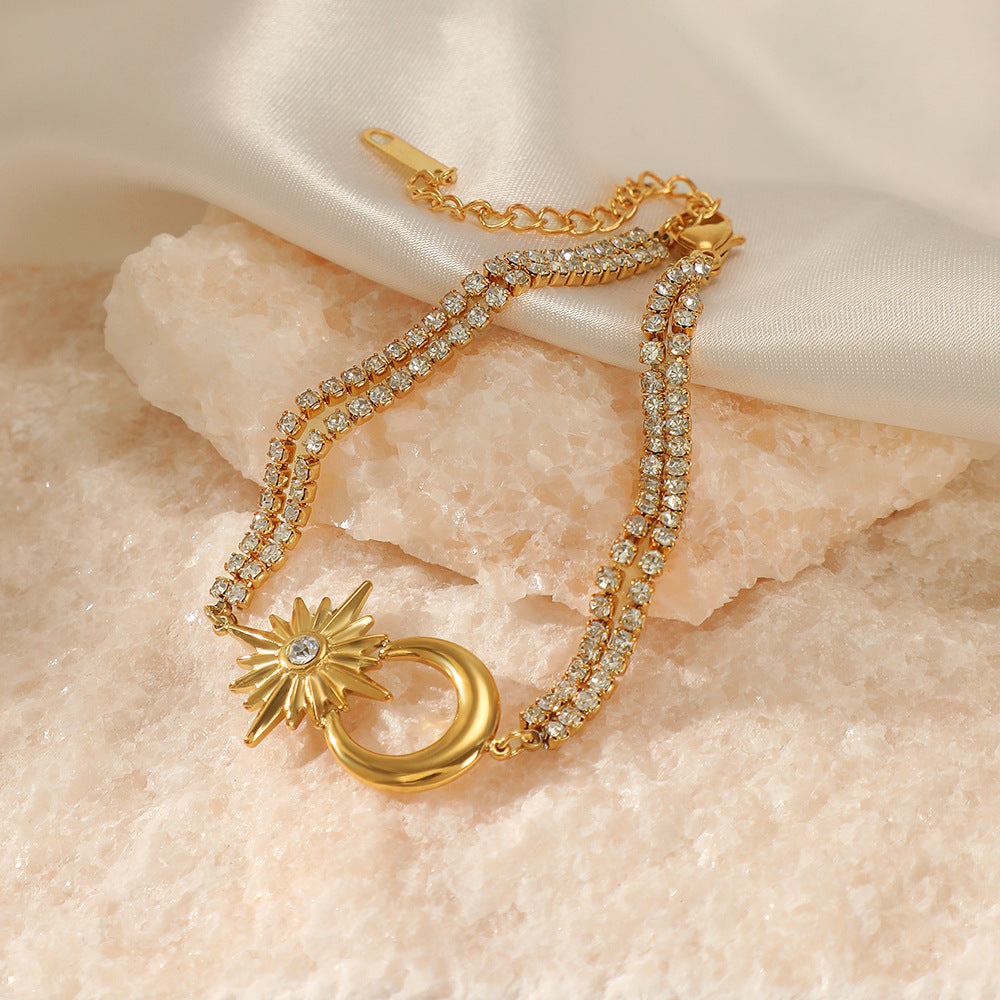 Divine Celestial Glow Bracelet with crescent moon and starburst design on elegant textured background.