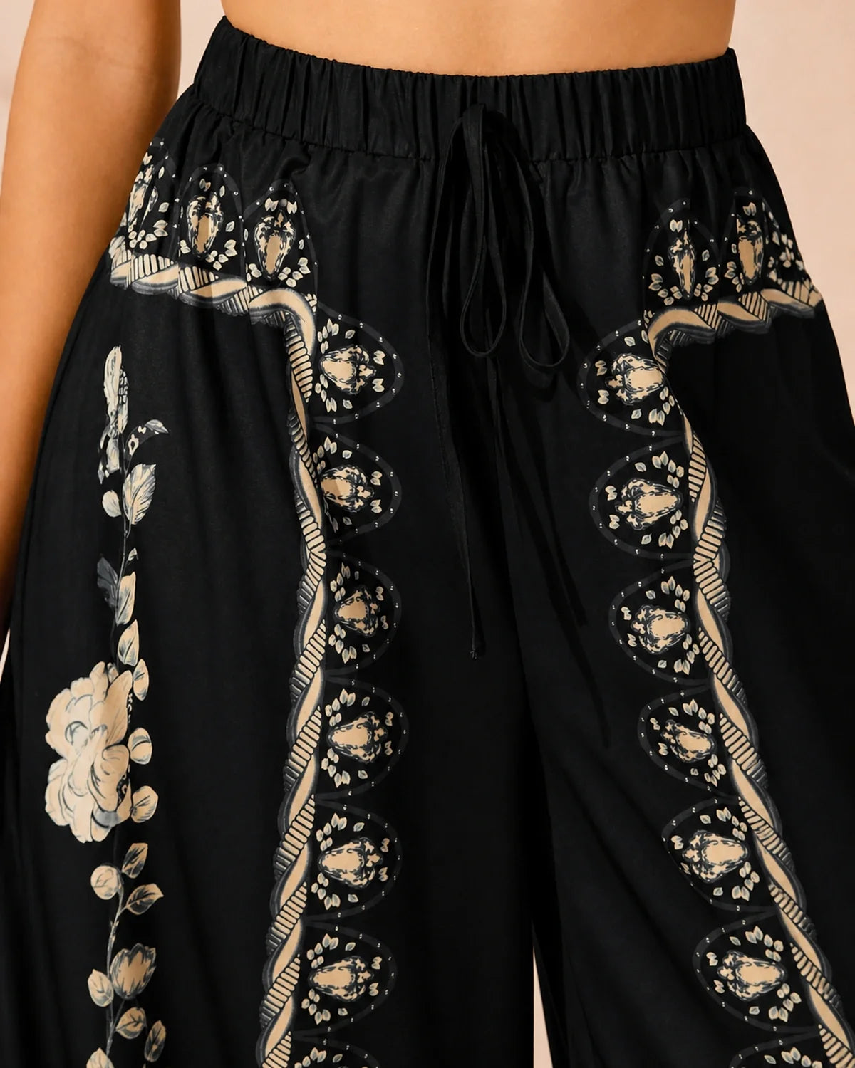 Elastic drawstring waistband and cream border detail on Floral Flow Pants