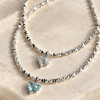Radiant Love Crystal Necklace clear and aquamarine heart pendants on stone