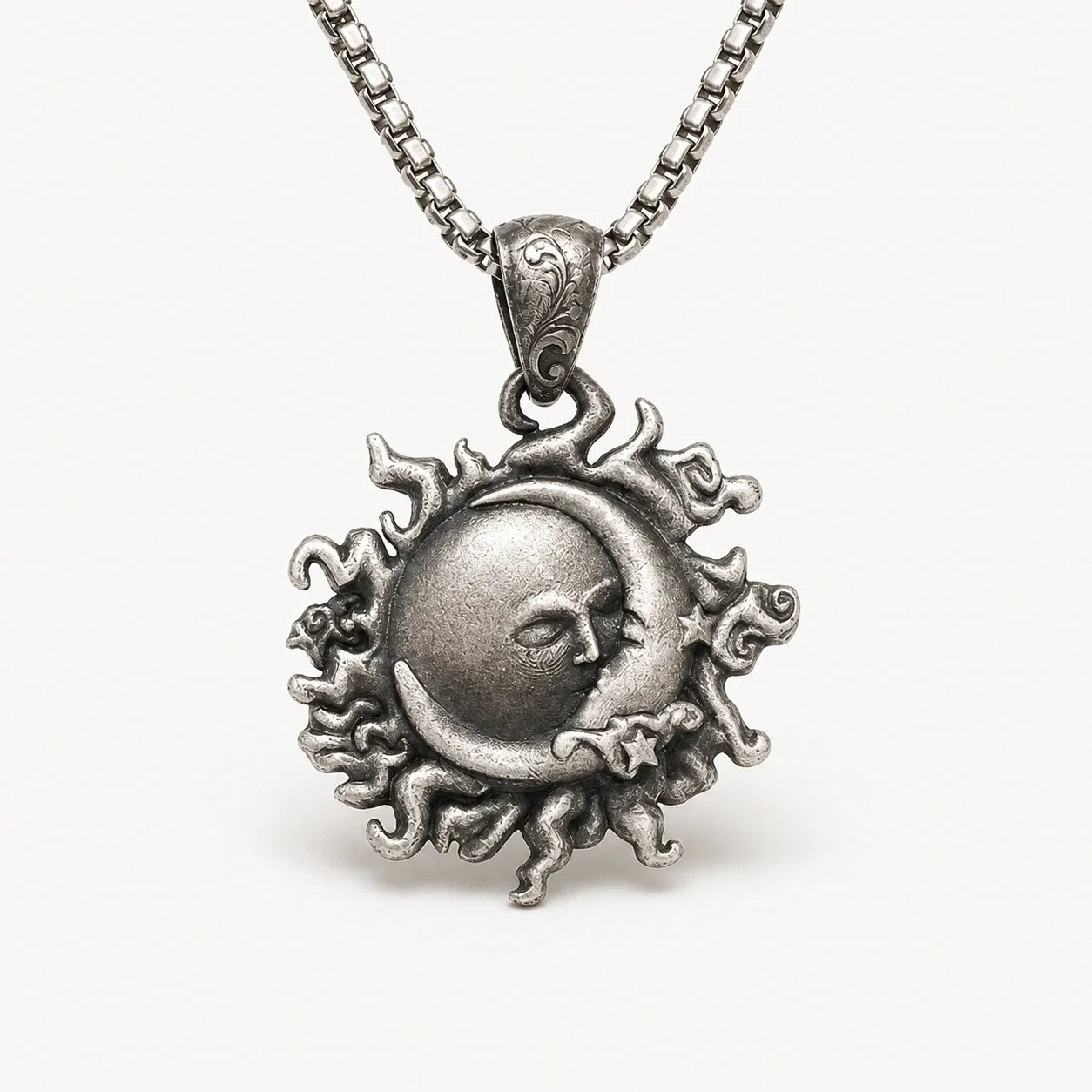 Sun Moon Sacred Union Necklace in antique silver on a warm white studio background