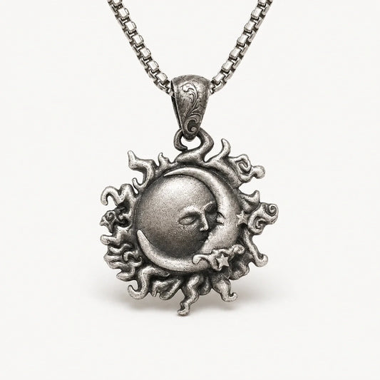 Sun Moon Sacred Union Necklace in antique silver on a warm white studio background