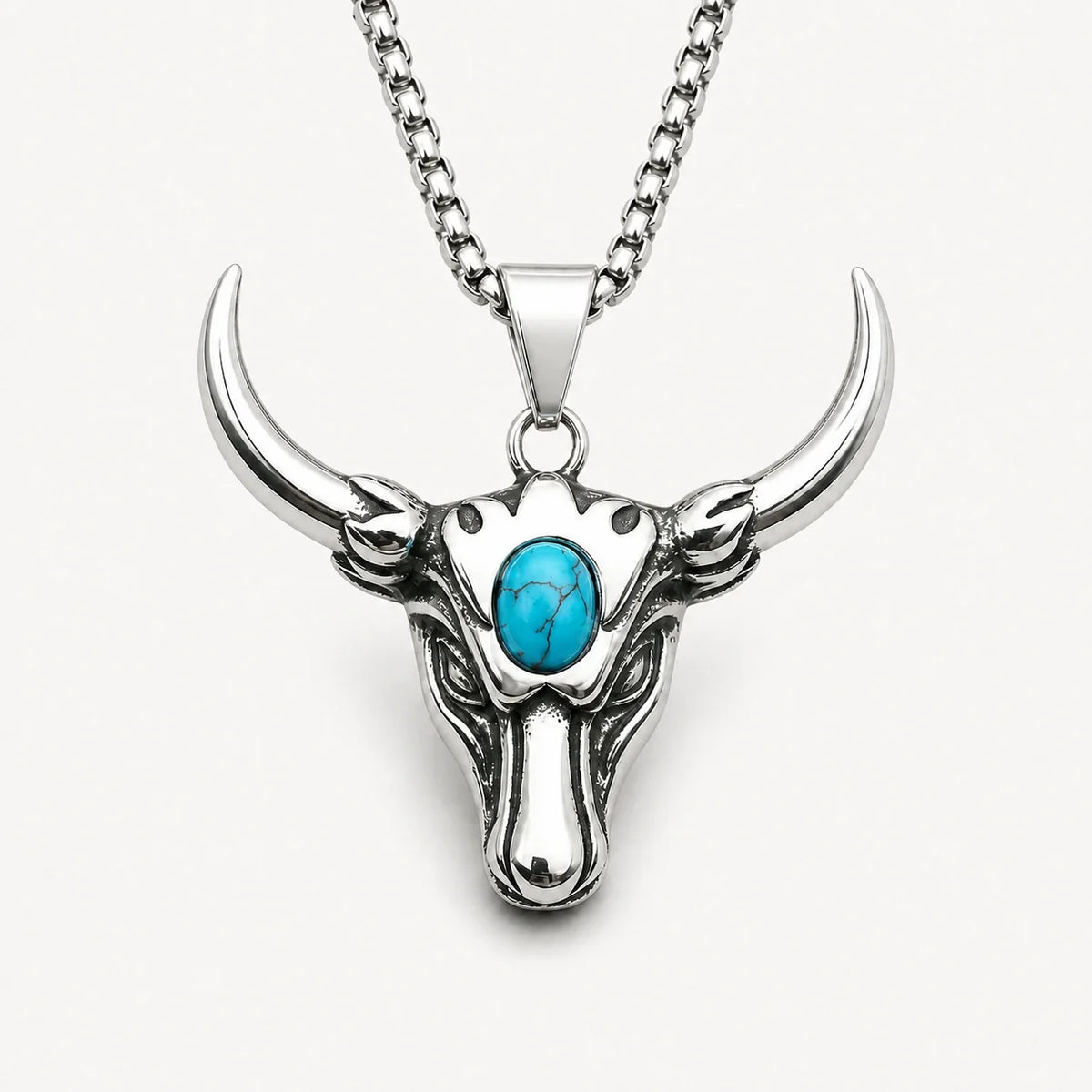 Taurus Guardian Necklace with turquoise accent on a warm white studio background