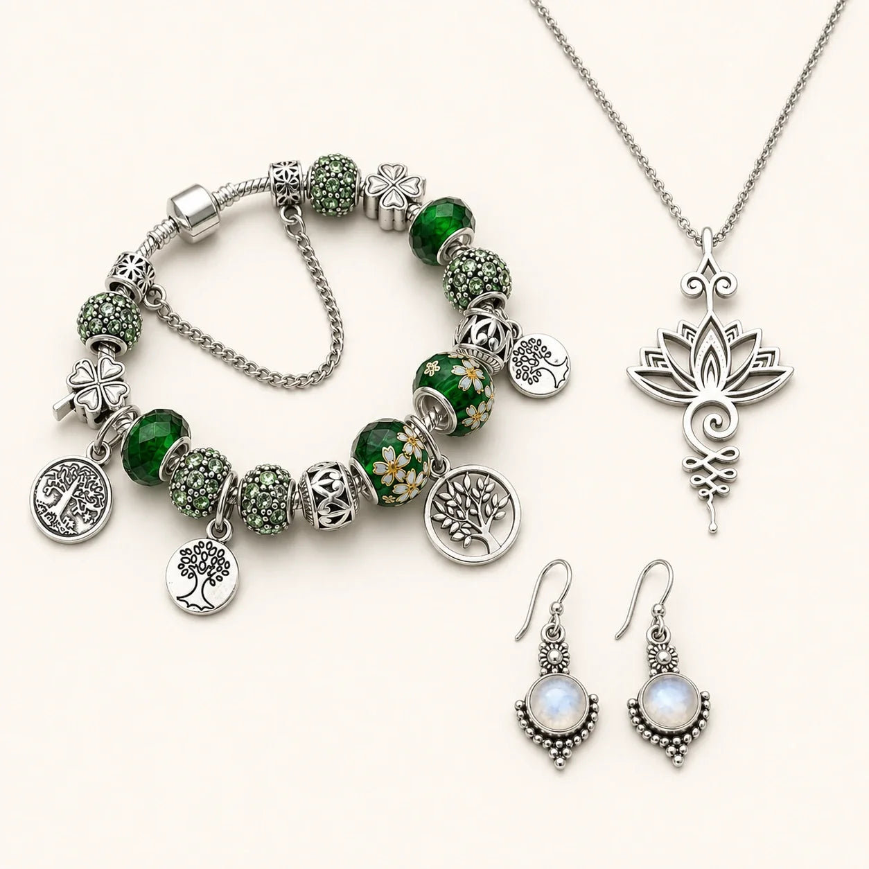 The Harvest Trio bracelet, lotus necklace, and moonstone earrings on a warm white studio background