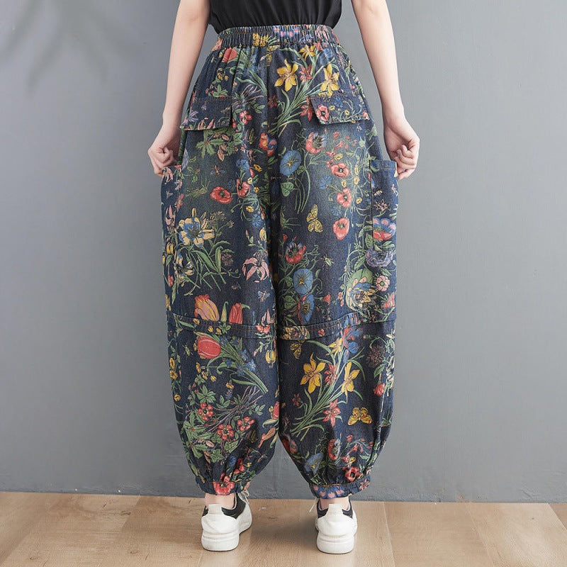 Dark balloon-leg jeans with colorful botanical print and large patch pockets