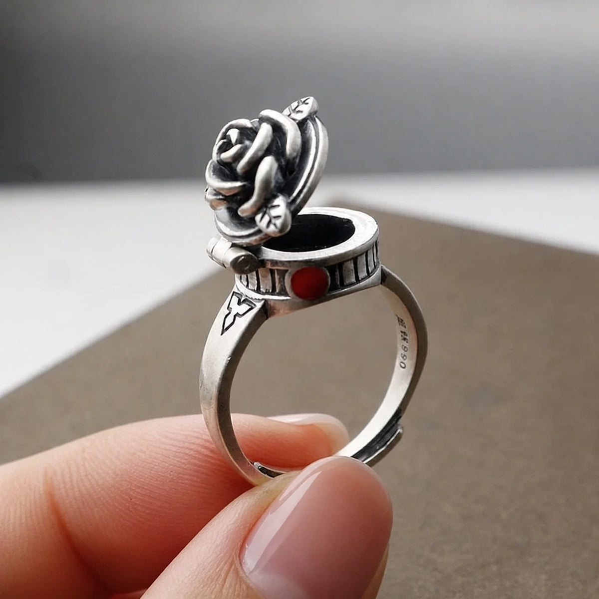 Witches Secret Locket Ring held by a woman's hand